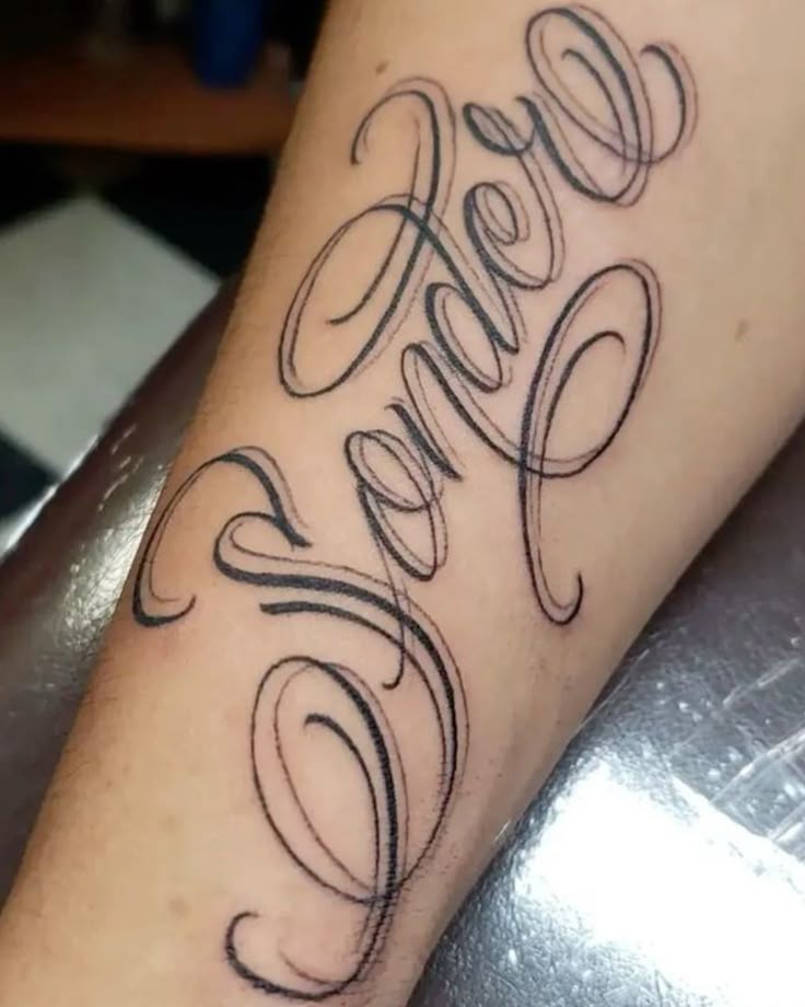 Oversized Flowing Cursive Sonder Tattoo Design