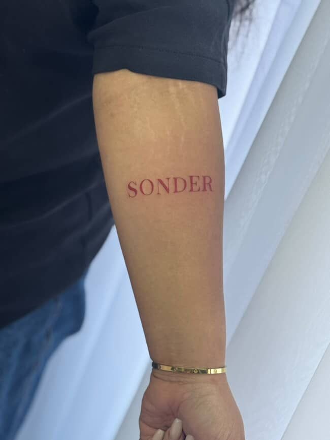 Soft Red Sonder Forearm Minimal Tattoo Design
