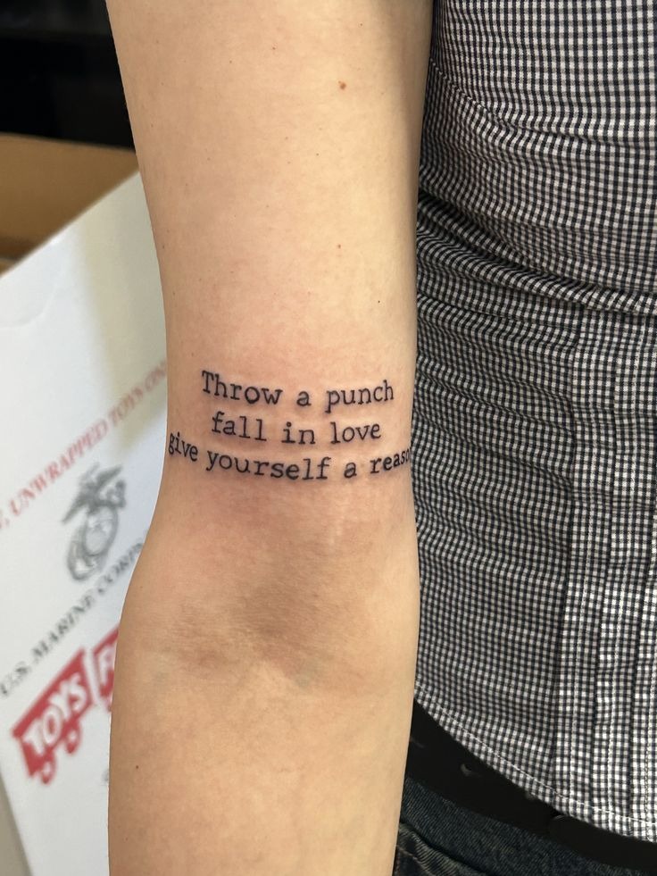 Heart-Shaped Lyric Tattoo with Romantic Rock Energy Tattoo Design