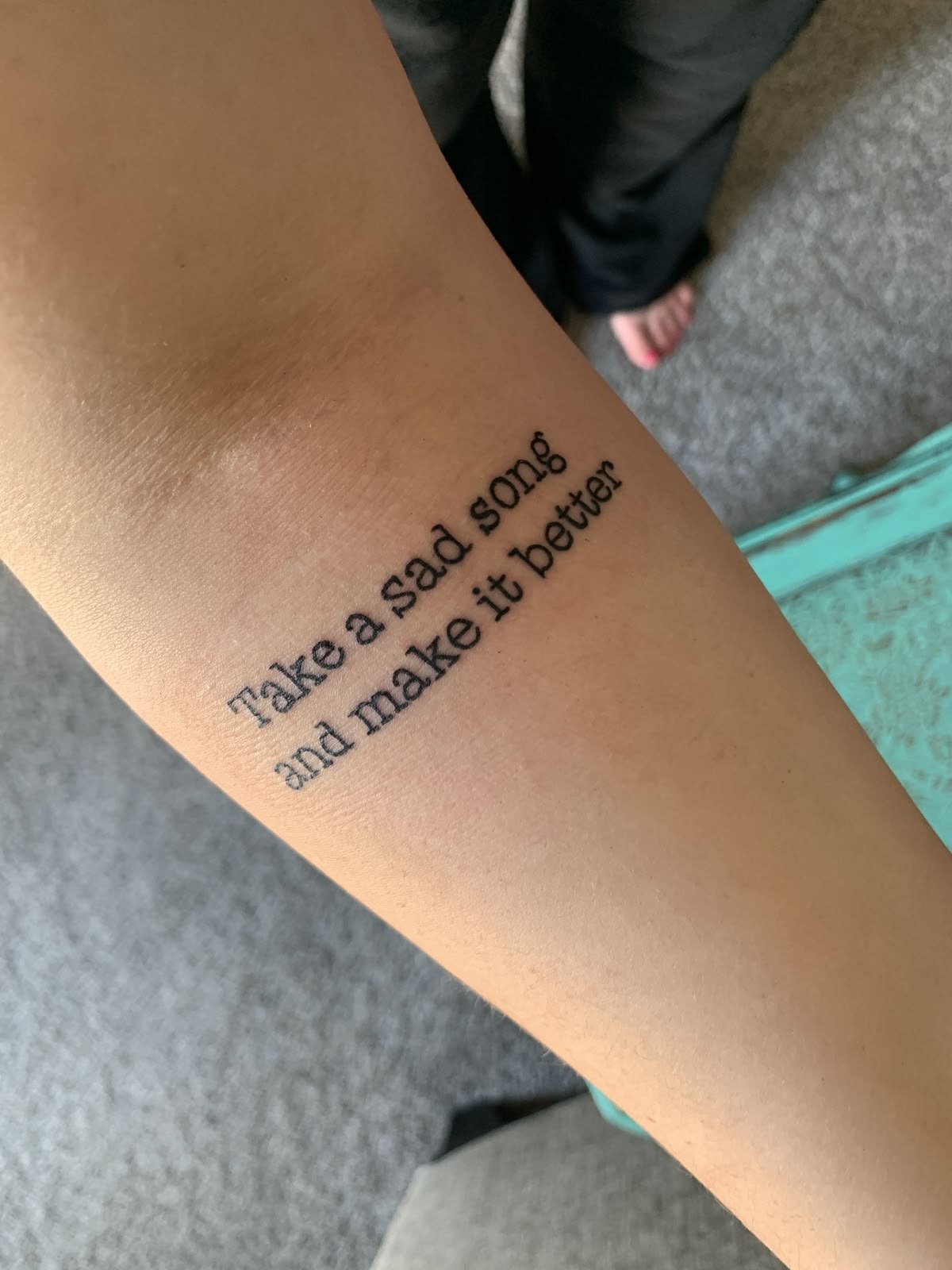 Inner Arm Lyric Tattoo with Soft Nostalgic Energy Tattoo Design