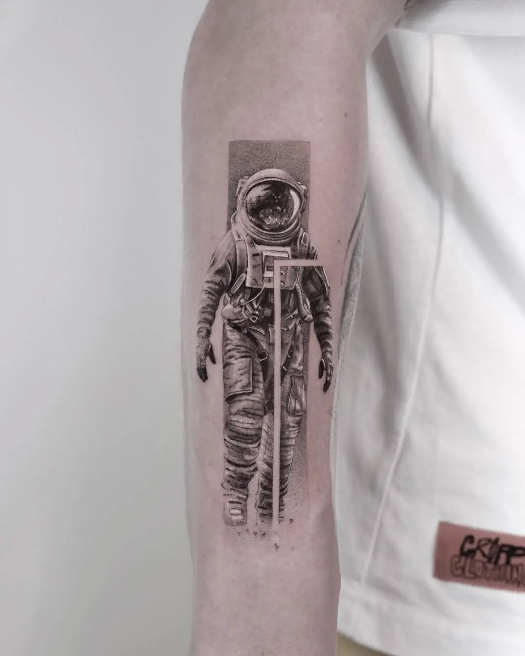Astronaut Holding a Cosmic Bouquet Tattoo Design