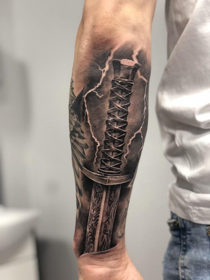 Electric Spartan Sword Tattoo, a tattoo design rendered in clean detailed linework.