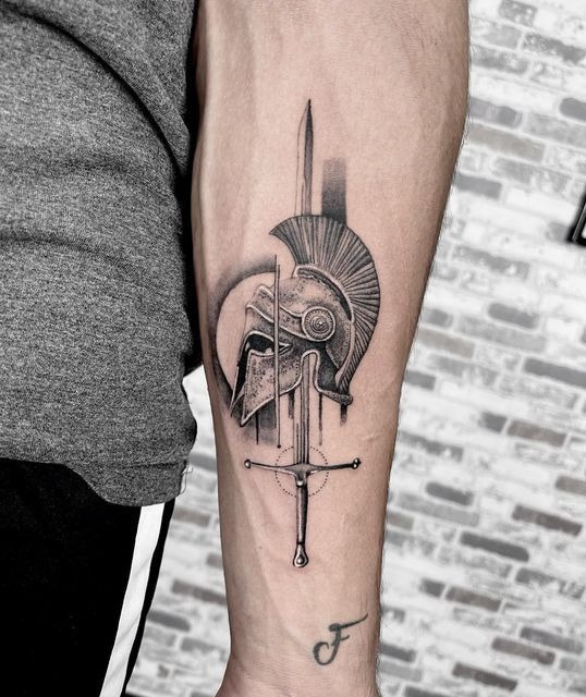 Spartan Helmet and Sword Tattoo, a tattoo design rendered in clean detailed linework.