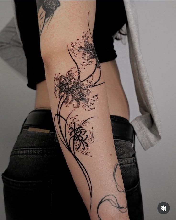 Flowing Spider Lilies on the Arm Tattoo Design