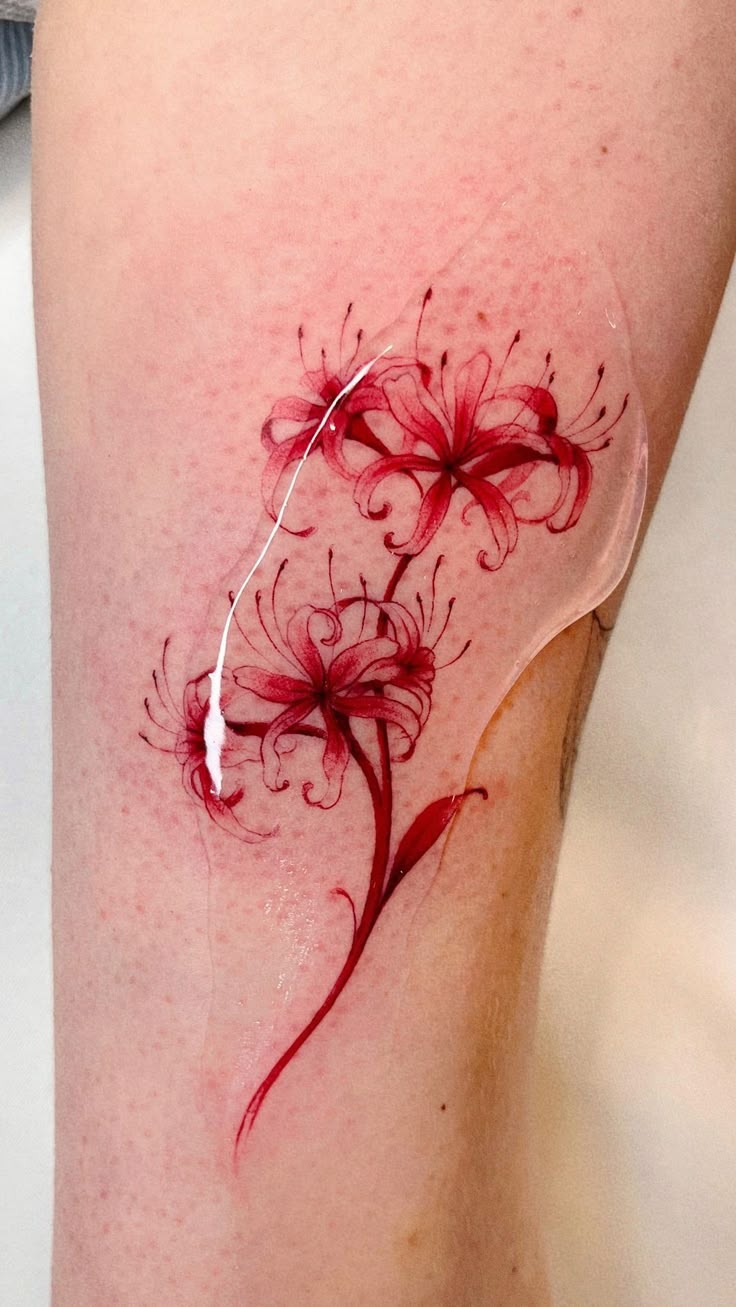 Glossy Red Thigh Lilies Tattoo Design