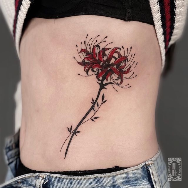 Single Lily on the Ribcage Tattoo Design