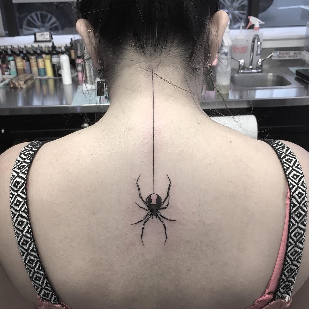 Bold spider tattoo running down the spine Tattoo Design
