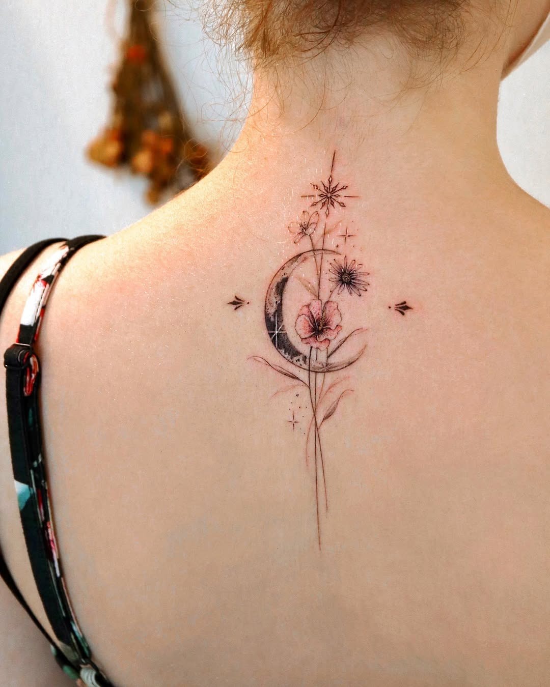Delicate moon and floral spine tattoo design Tattoo Design