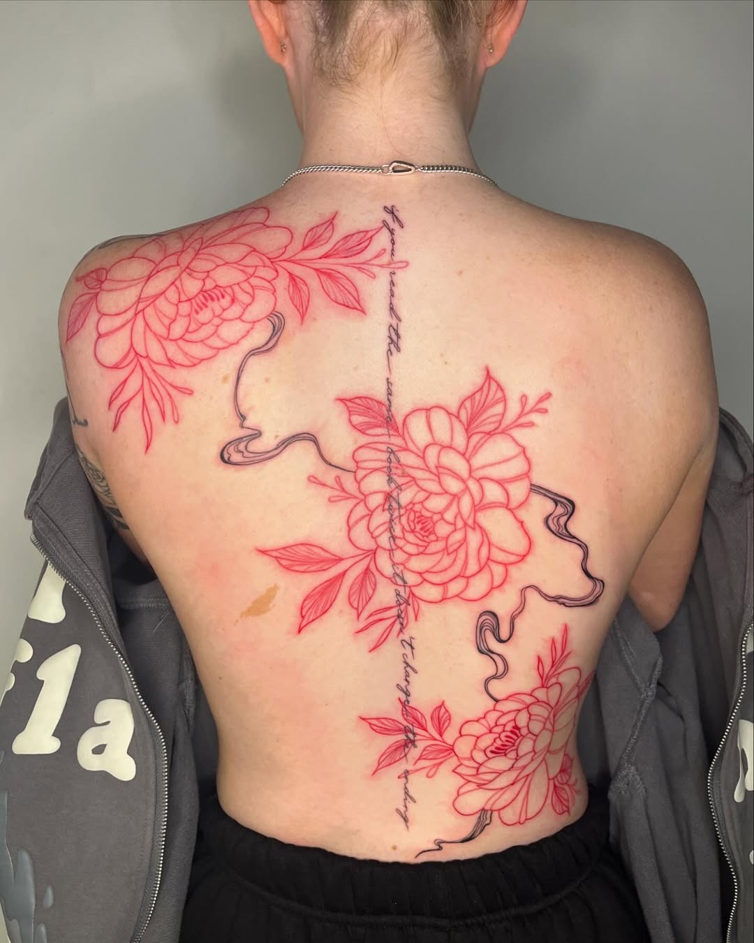 Elegant floral spine tattoo with delicate lines Tattoo Design