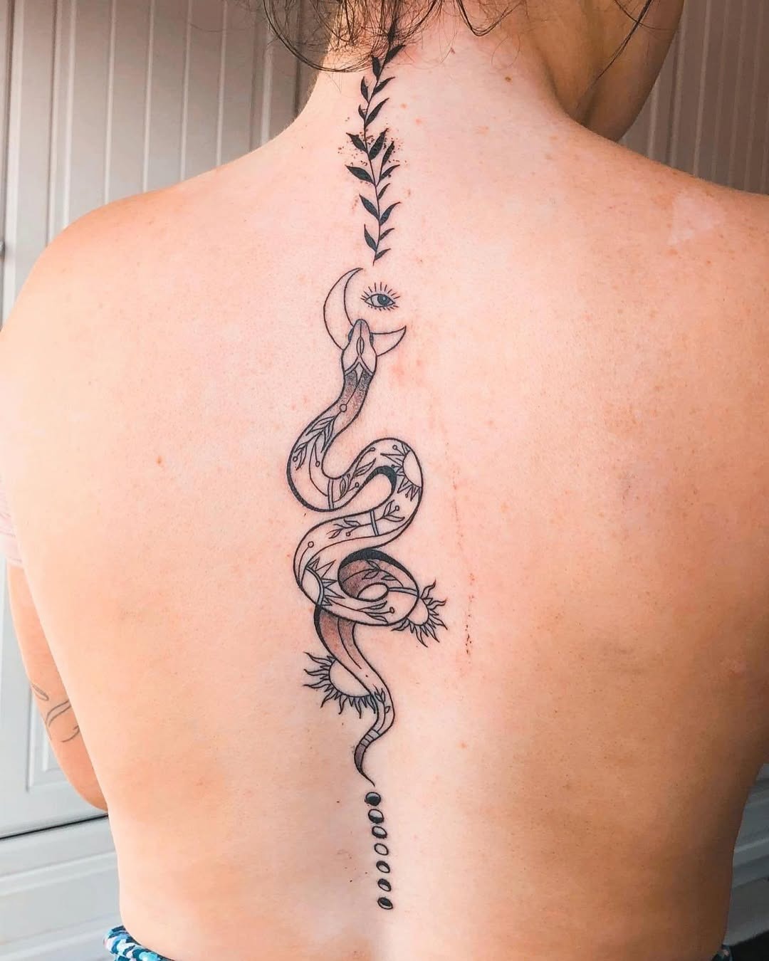 Elegant snake tattoo along the spine Tattoo Design