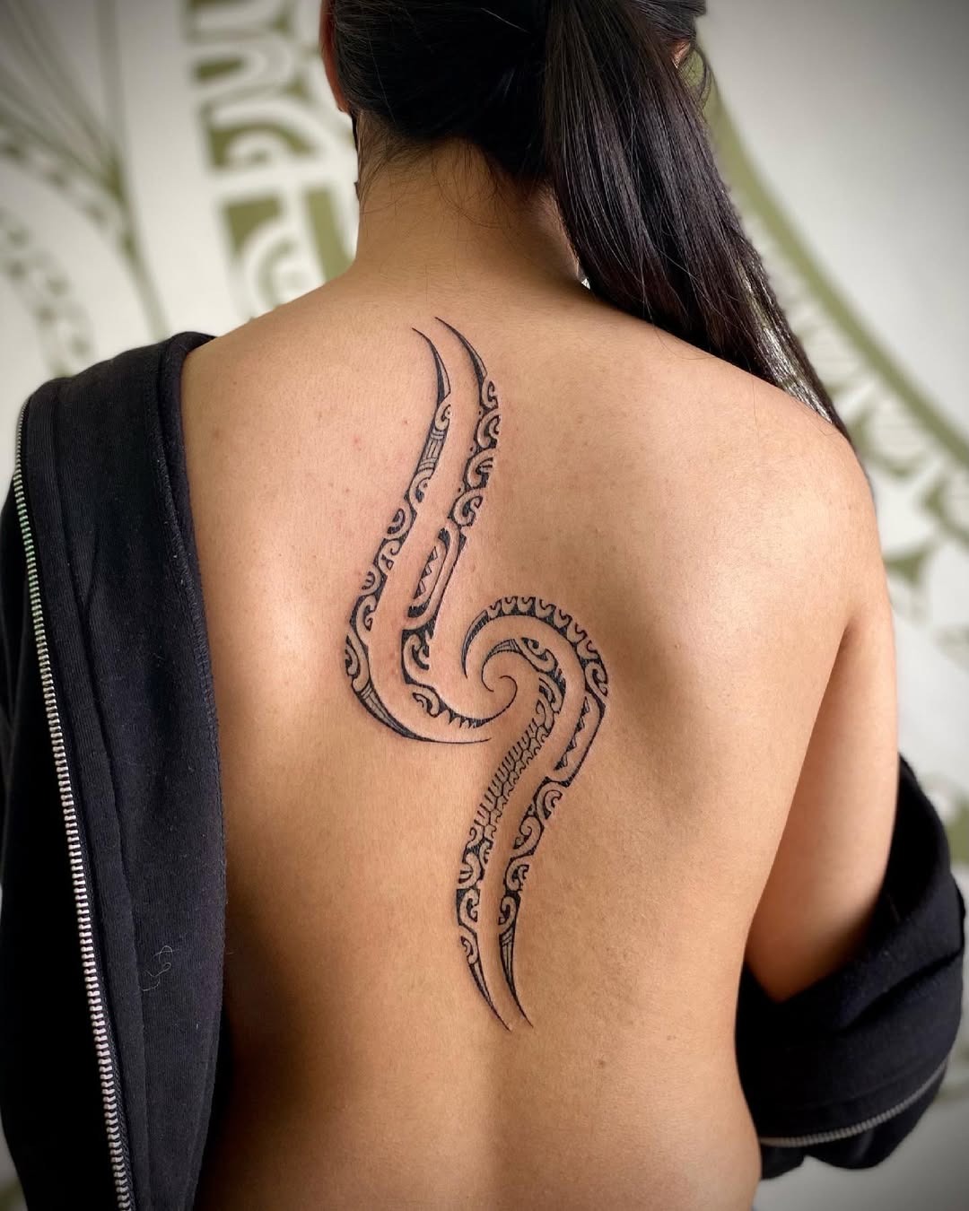 Intricate spine tattoo with an octopus design Tattoo Design