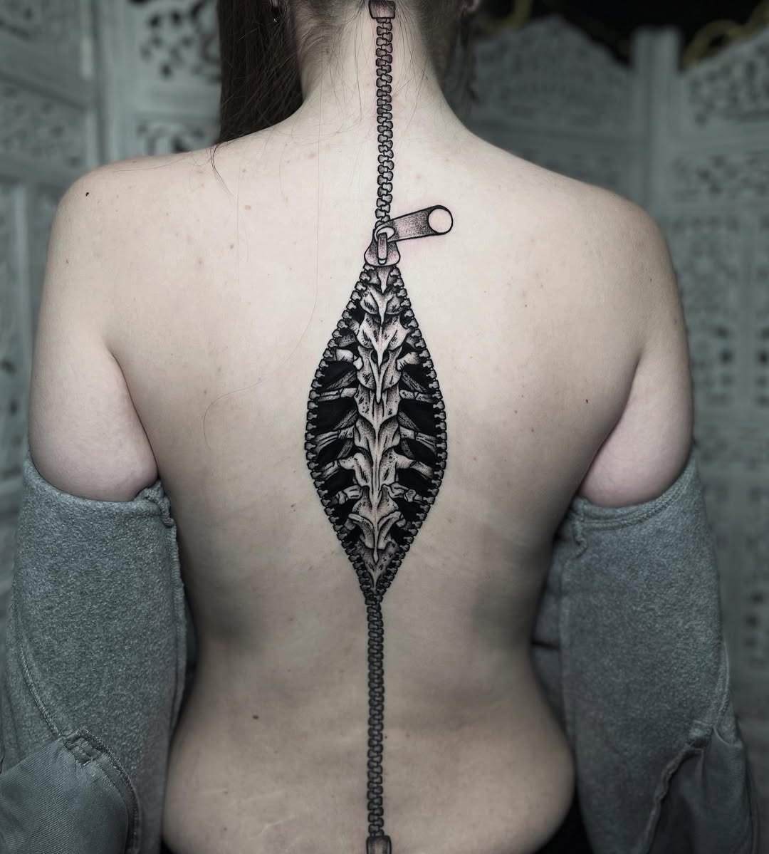Intricate spine tattoo with zipper design Tattoo Design