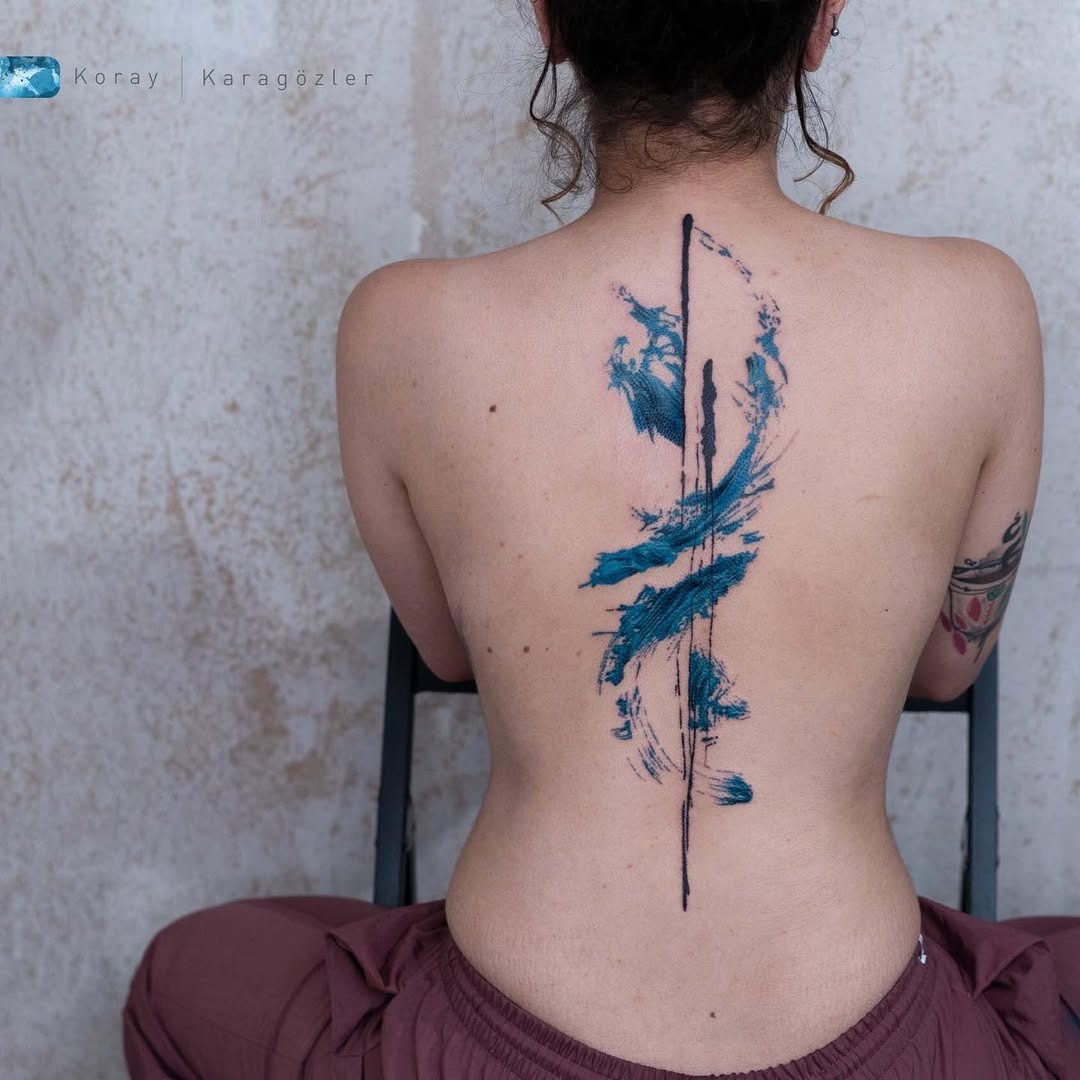 Striking color meets abstract spine tattoo design Tattoo Design