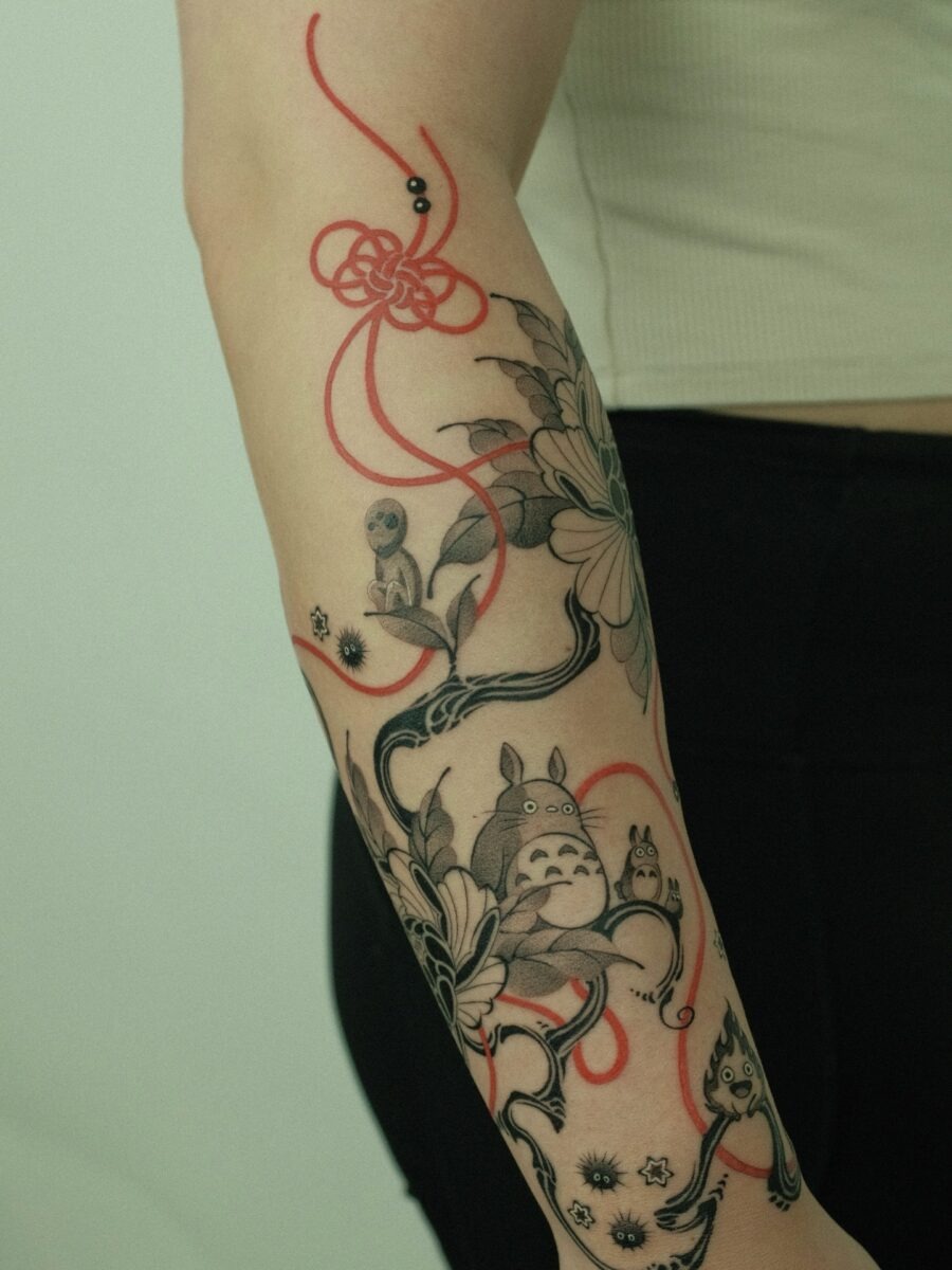 A whimsical Totoro tattoo design with flowers Tattoo Design
