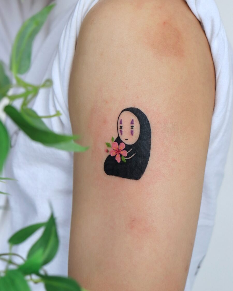 Charming No-Face Tattoo with Floral Detail Tattoo Design