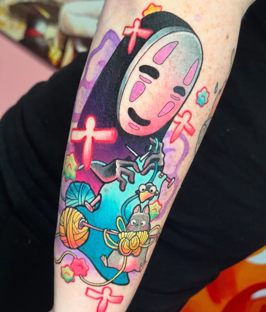 No Face amidst vibrant Spirited Away elements Tattoo Design