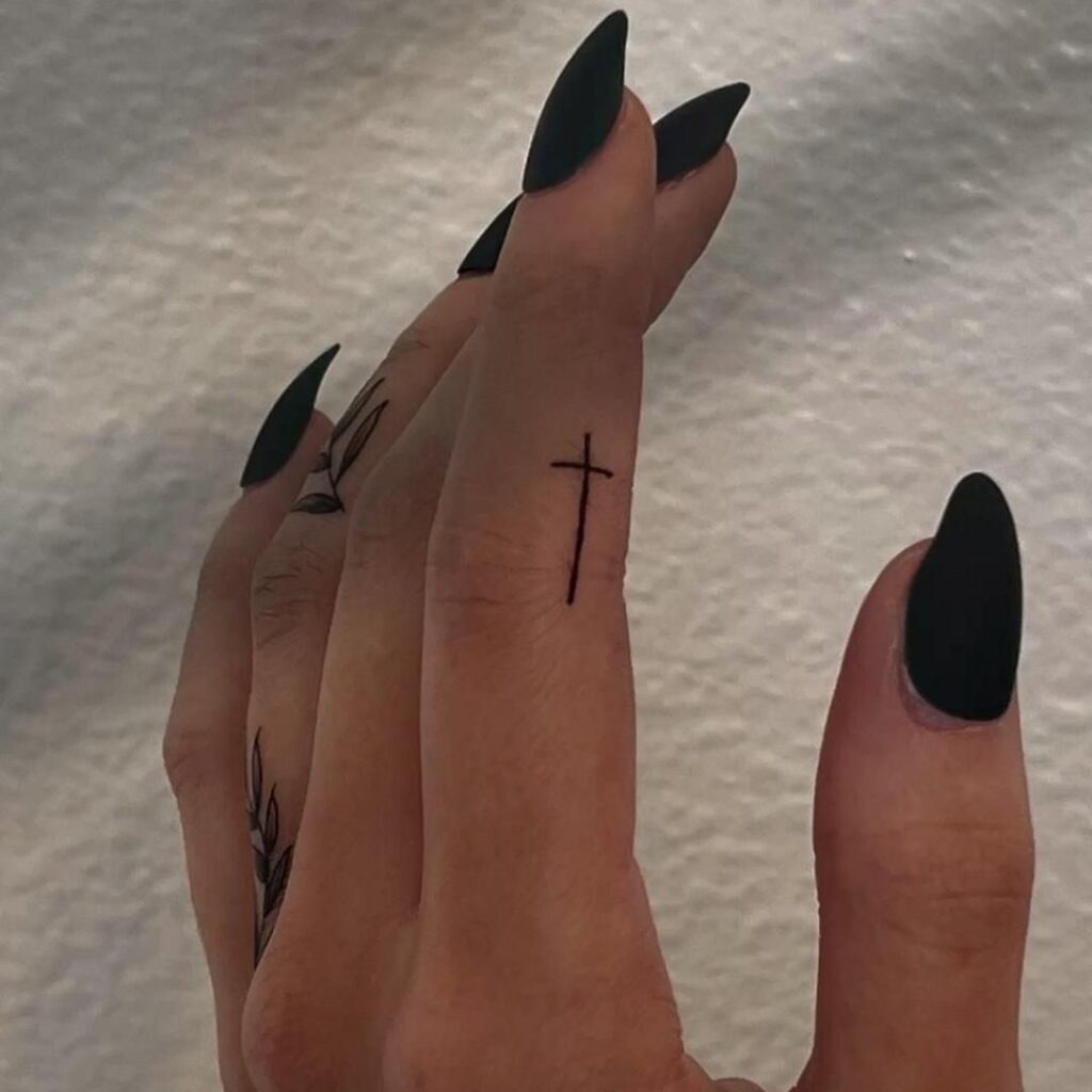 Minimalist Cross Tattoo on Finger Tattoo Design