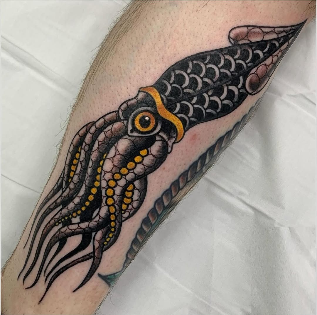 Bold and colorful squid tattoo on leg Tattoo Design
