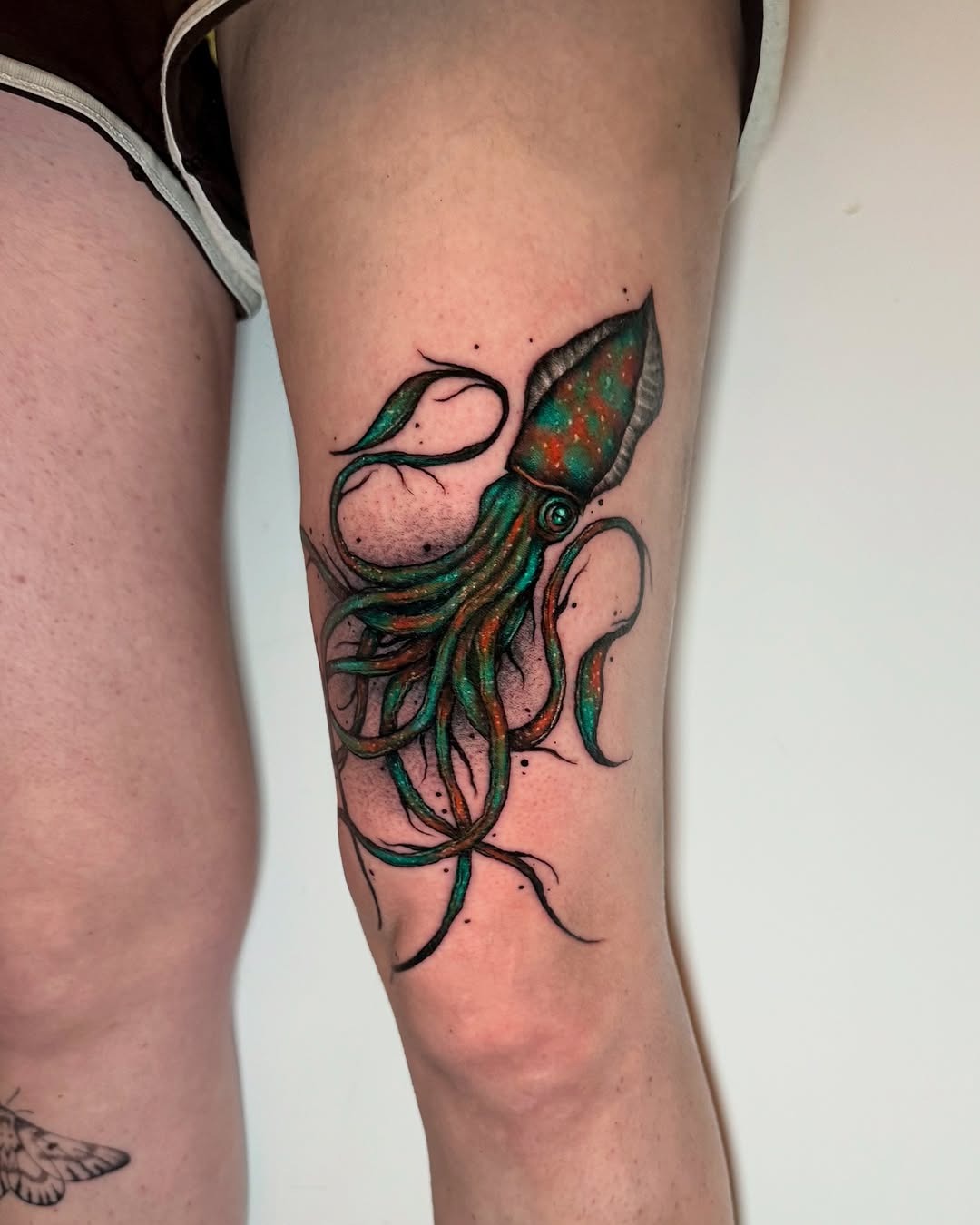 Colorful squid tattoo showcasing detailed artistry Tattoo Design