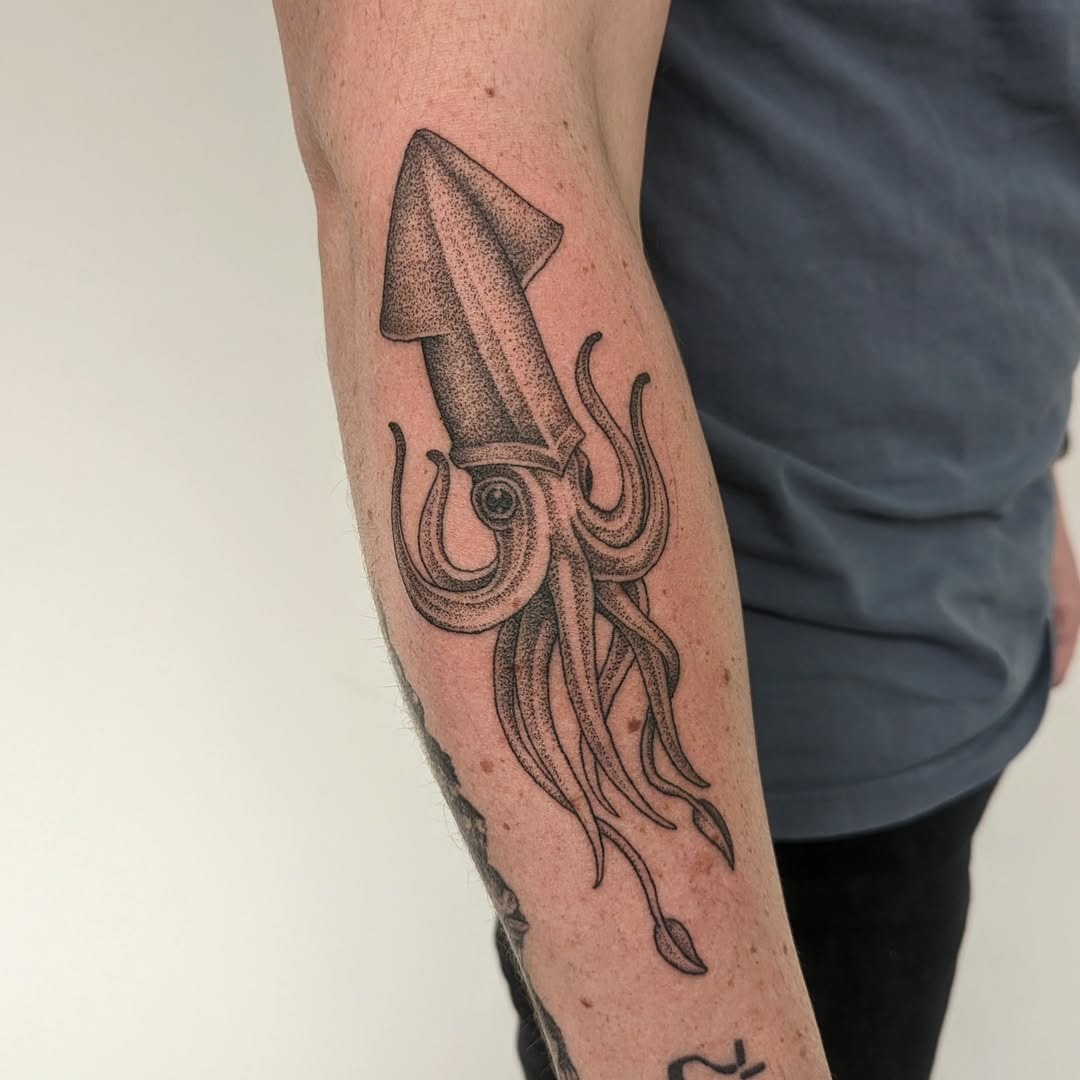 Detailed squid tattoo with striking realism Tattoo Design