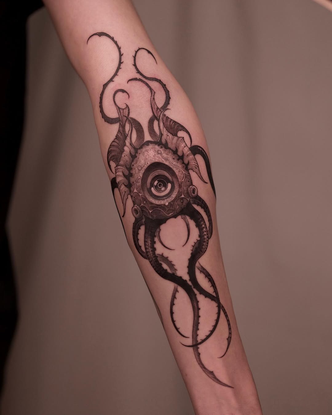 Eerie squid tattoo featuring an eye design Tattoo Design