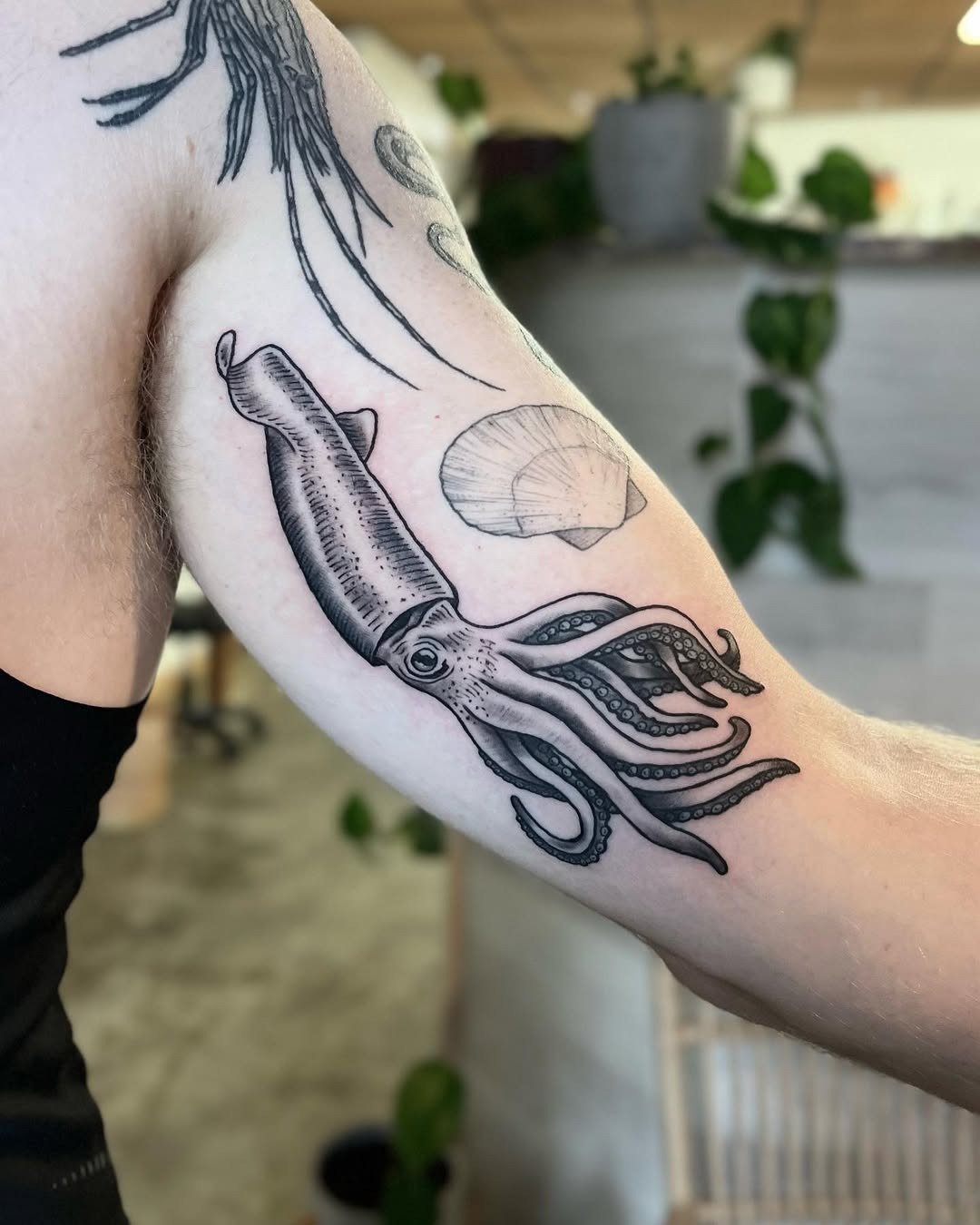 Elegant Squid Tattoo with Shell Design Tattoo Design