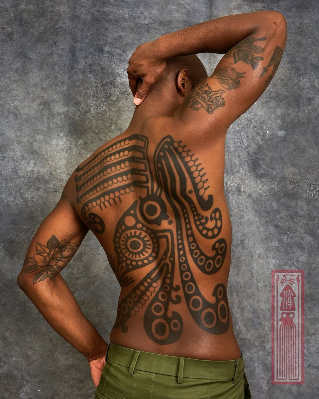 Intricate squid tattoo adorns the entire back Tattoo Design