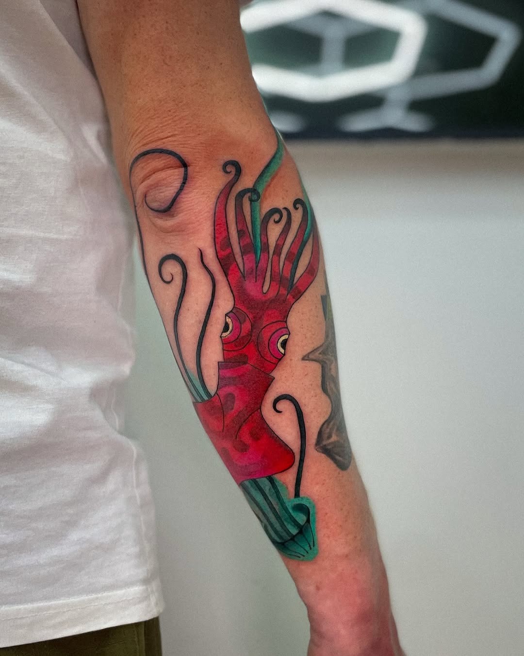 Intricate squid tattoo bursting with colors Tattoo Design