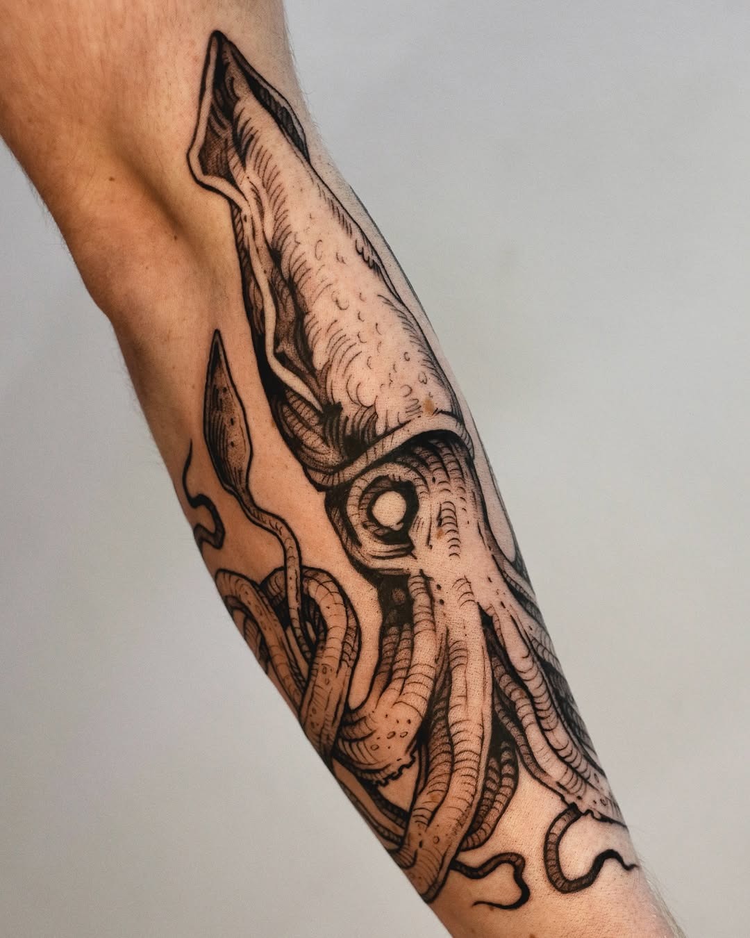 Intricate Squid Tattoo on Forearm Tattoo Design