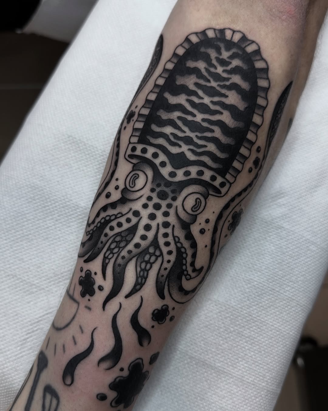 Intricate squid tattoo with bold black details Tattoo Design