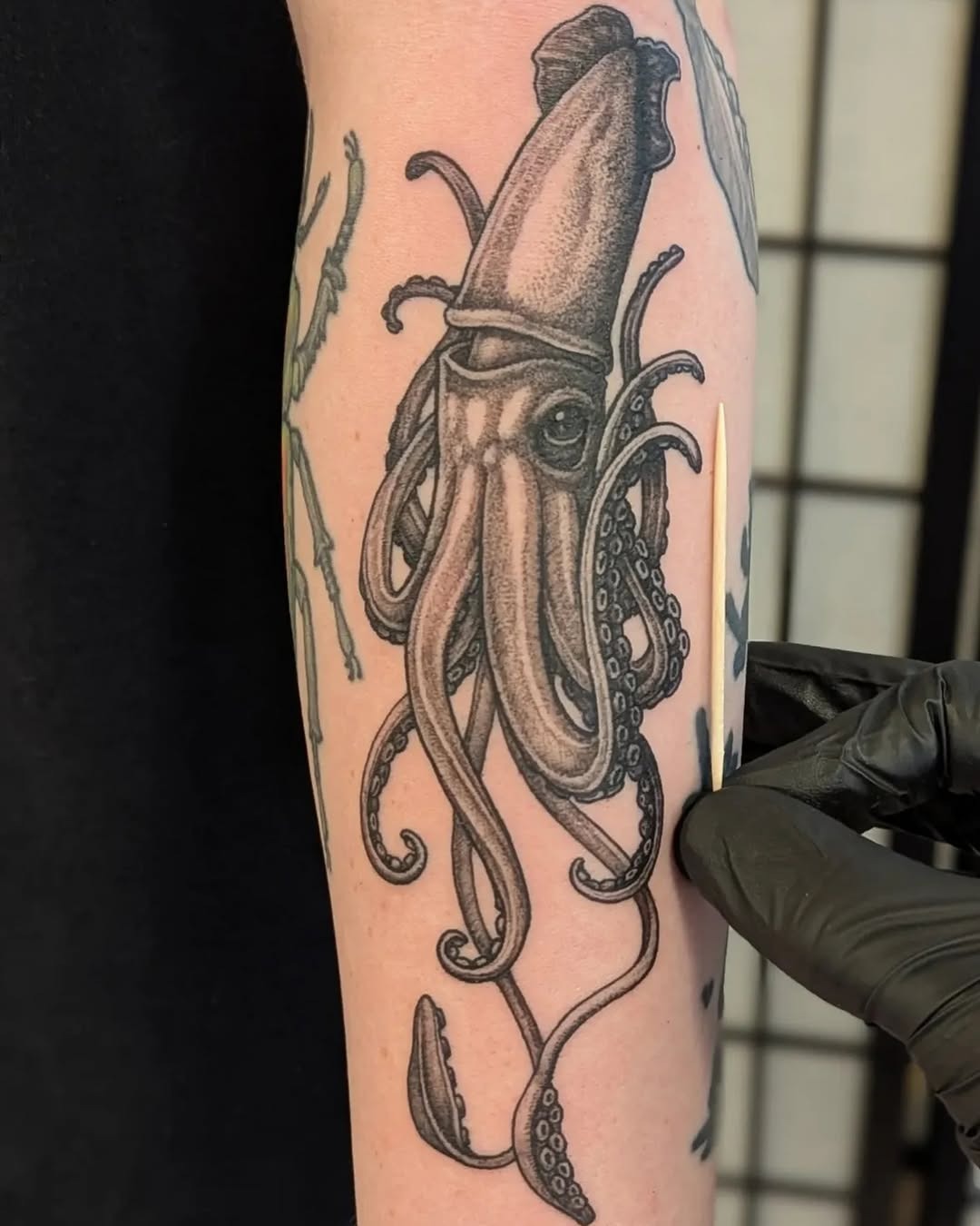 Intricate squid tattoo with detailed artistry Tattoo Design
