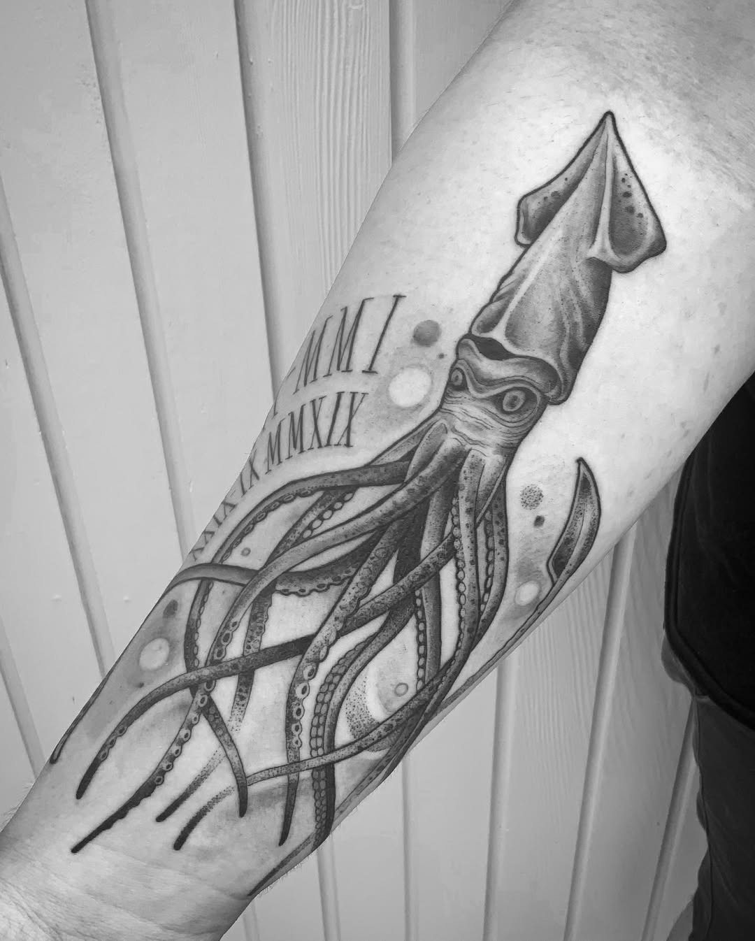 Intricate squid tattoo with flowing tentacles Tattoo Design