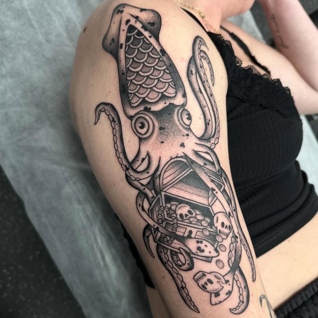 Intricate squid tattoo with hidden details Tattoo Design