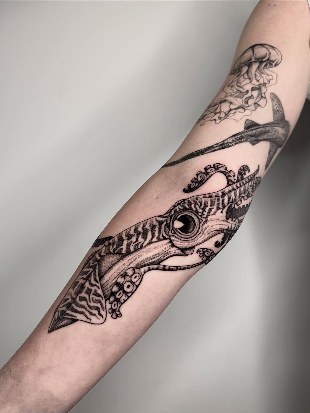 Stylish squid tattoo showcasing intricate details. Tattoo Design
