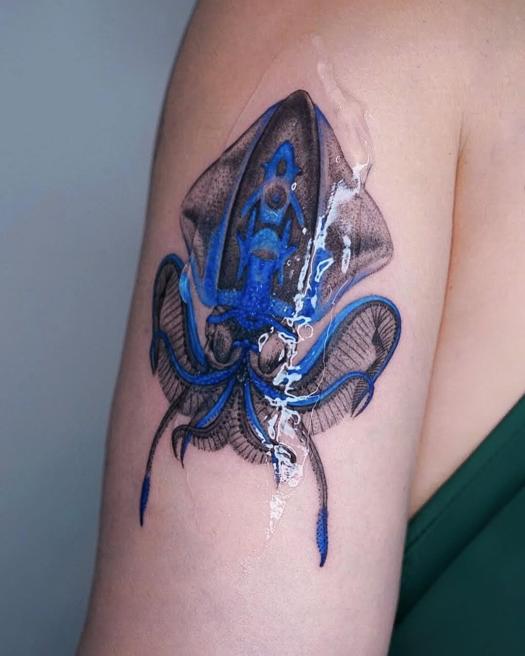 Vibrant squid tattoo blends realism and creativity Tattoo Design