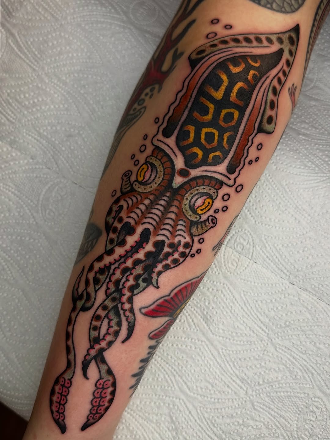 Vibrant squid tattoo showcasing geometric patterns Tattoo Design