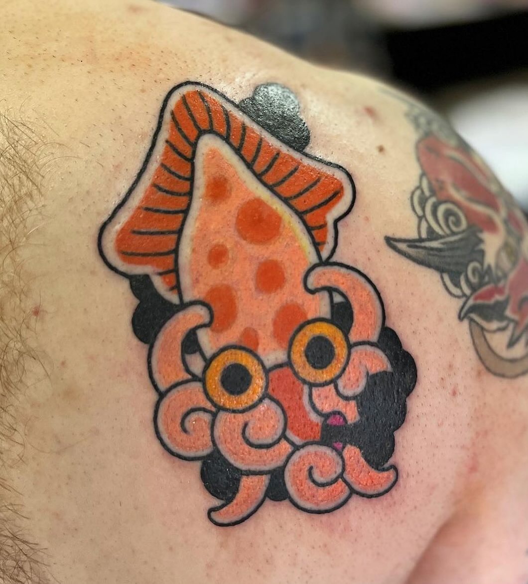 Vibrant squid tattoo with playful cartoon style Tattoo Design