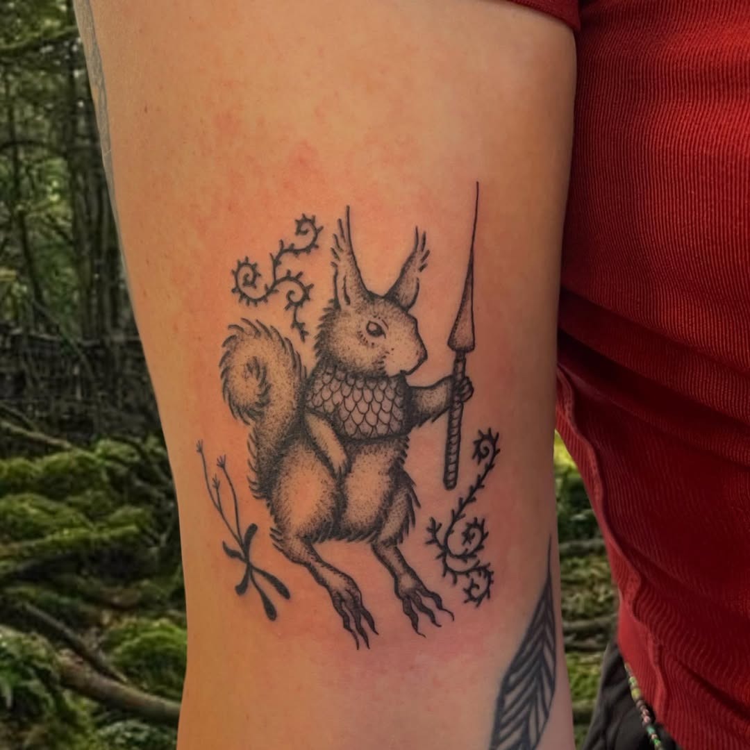A whimsical squirrel holding a spear tattoo Tattoo Design