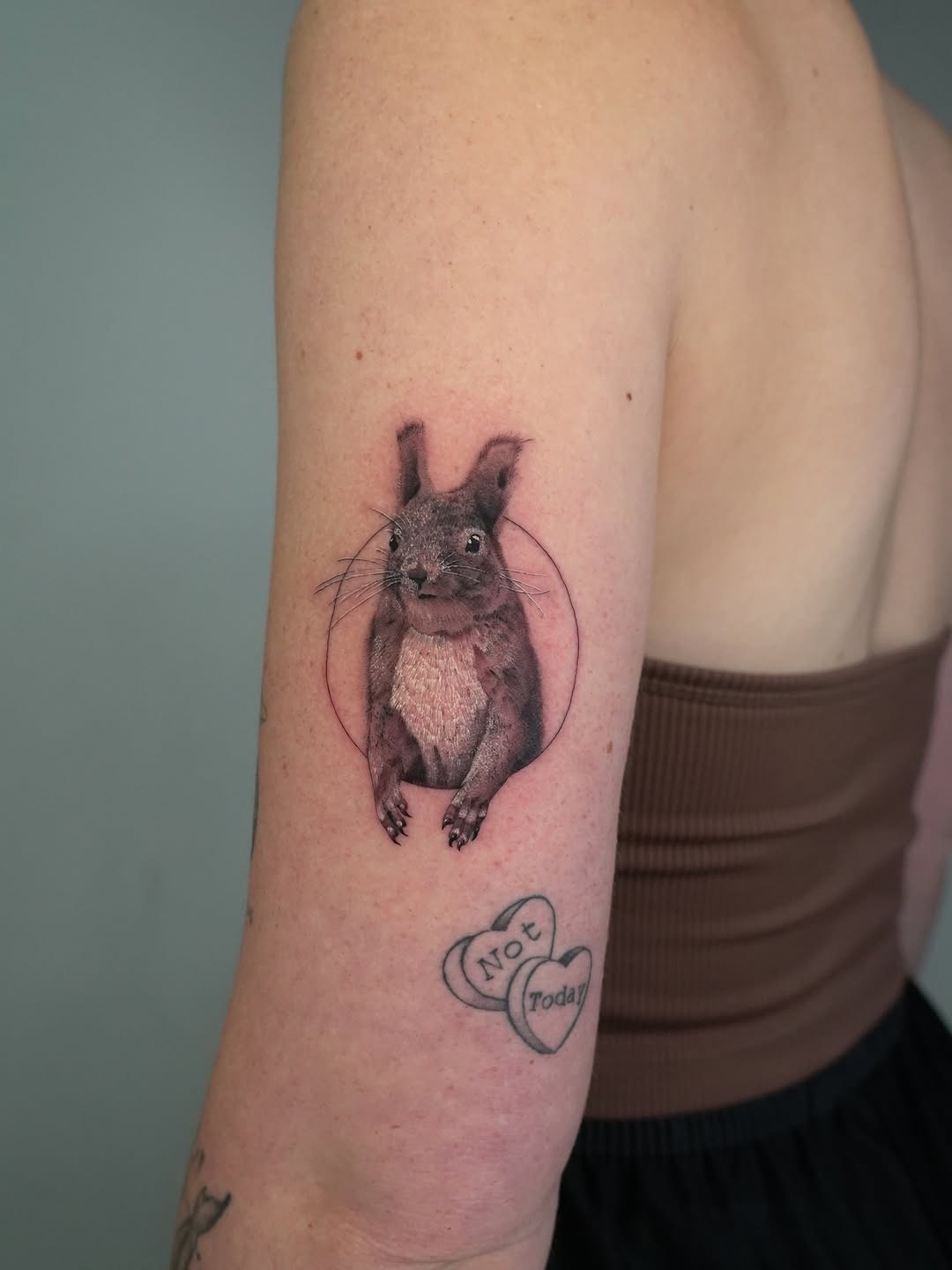 Charming realistic squirrel tattoo on arm Tattoo Design