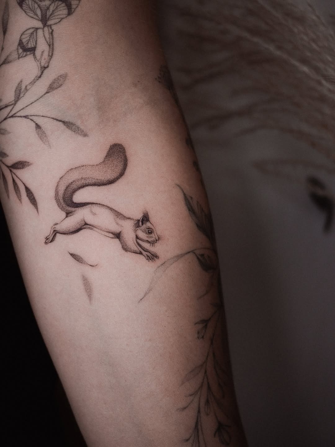 Elegant Squirrel Tattoo with Nature Elements Tattoo Design