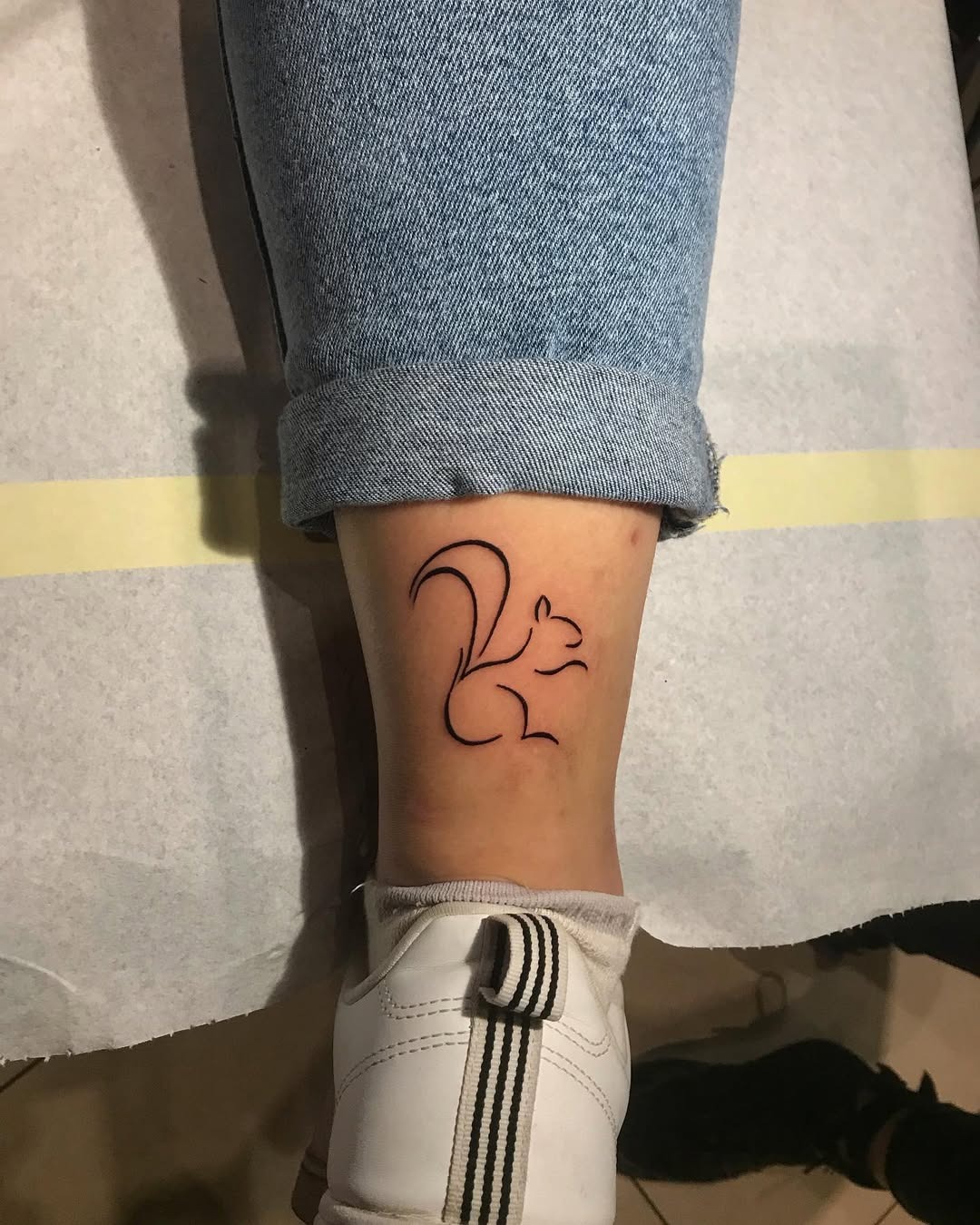 Minimalist Squirrel Tattoo on Ankle Tattoo Design
