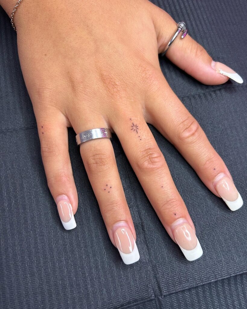 Minimalist Star Finger Tattoos with Subtle Dots Tattoo Design