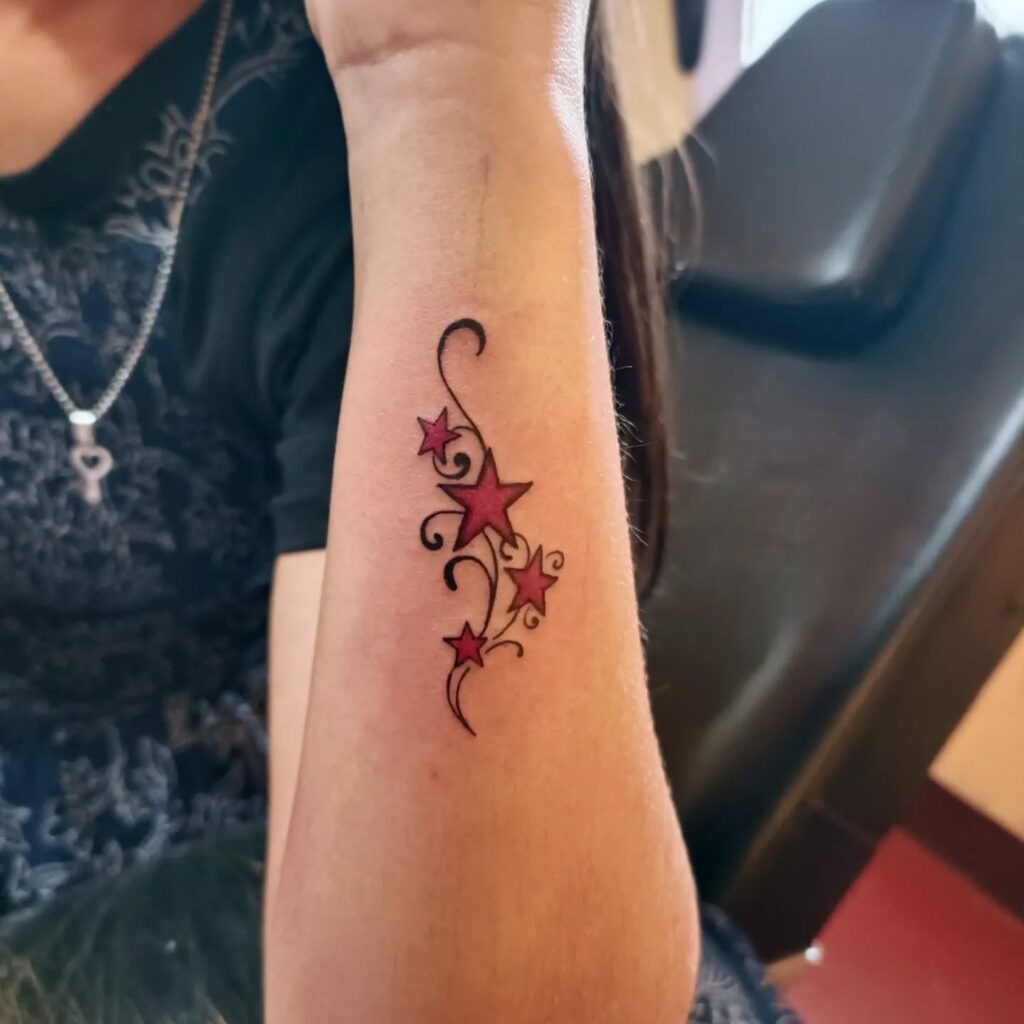Red Star Swirl Forearm Tattoo Tattoo Design