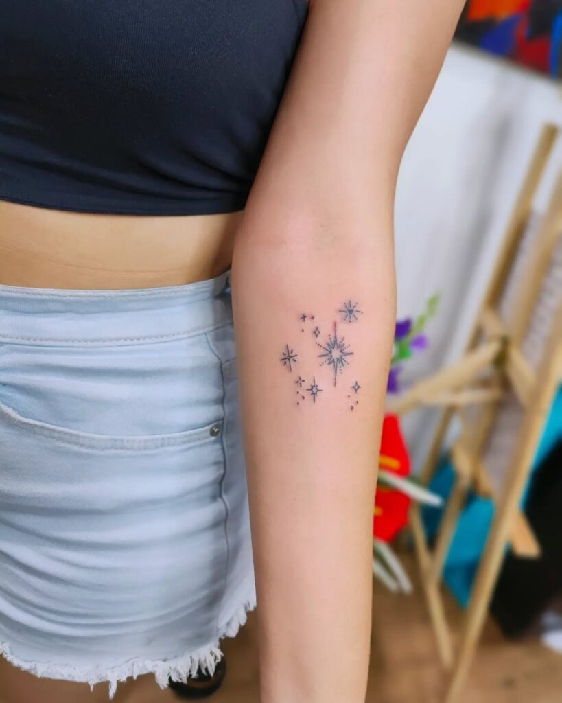 Sparkling Forearm Cosmic Cluster Tattoo Design