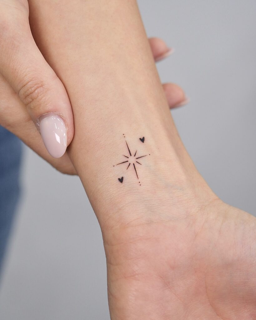Tiny Starburst and Hearts Wrist Tattoo Tattoo Design
