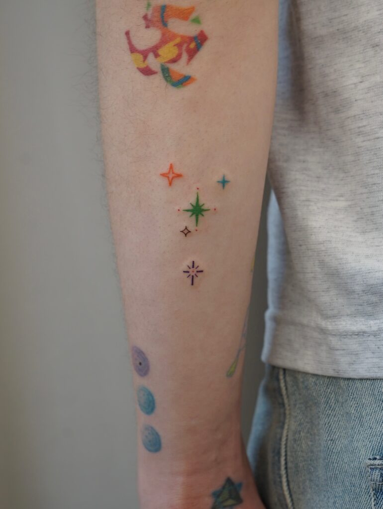 Vibrant Minimalist Starburst Tattoo Tattoo Design