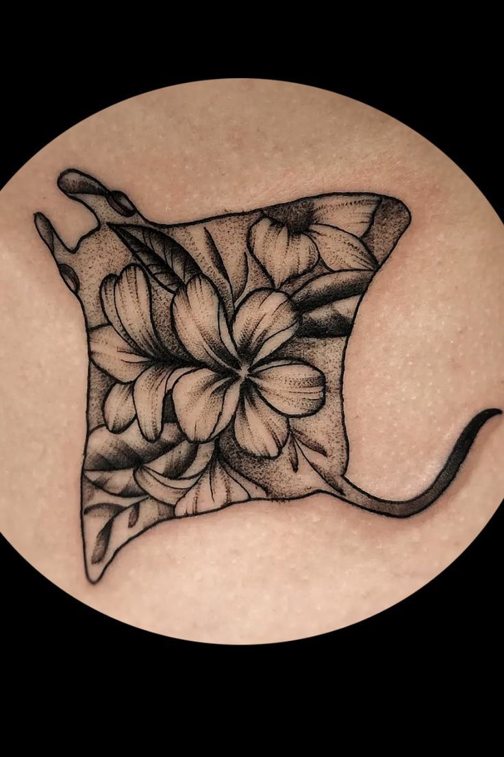 Floral-Filled Stingray Silhouette Tattoo Design