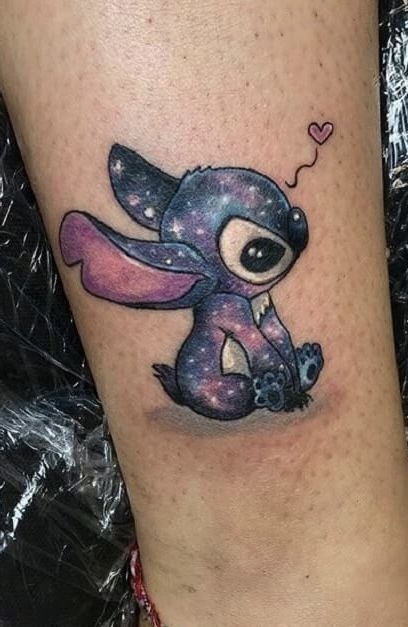 Galaxy Stitch Tattoo with Tiny Heart, a tattoo design rendered in clean detailed linework.