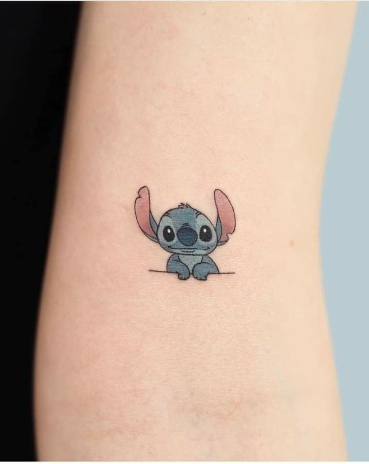 Minimalist Peeking Stitch Tattoo, a tattoo design rendered in clean detailed linework for the arm.