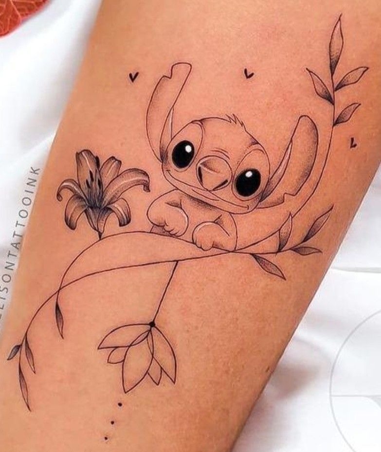 Stitch on a Flowering Branch Fine-Line Tattoo, a tattoo design rendered in delicate fine-line for the leg.